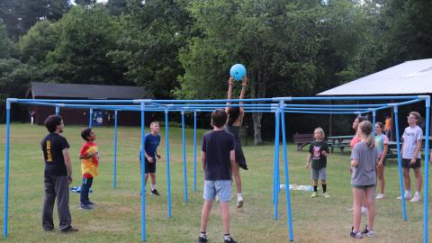 Youth Reaching for ball playing 9-Square