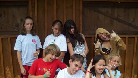 group of eight youth making faces toward the camera