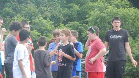 Group of youth on basketball court.