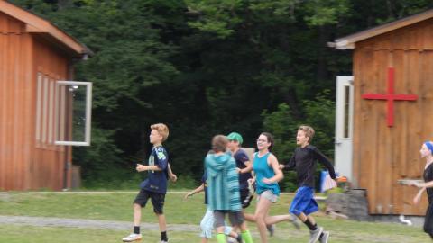 Group of youth skipping about in front of the nurse station.