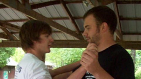 Two staff practice a waltz.