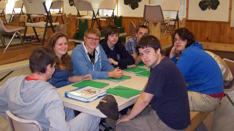 campers sitting at table 