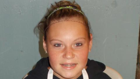 camper holding culinary creation 