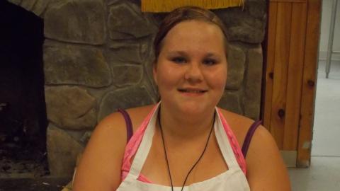 camper holding culinary creation 