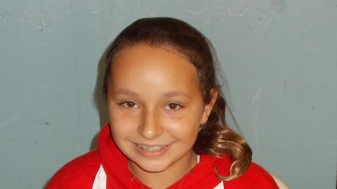 camper holding culinary creation 