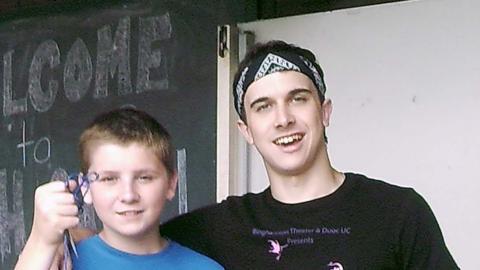 campers holding fish on line