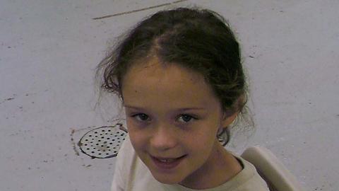 Camper holding chain and smiling