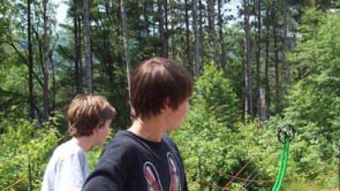 youth looking down range after firing their arrows.