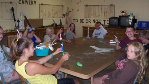 Youth show of their model rockets. 
