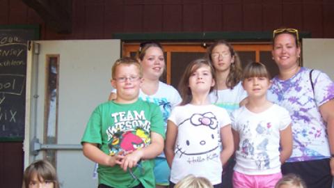 Group of youth in front of dining hall.