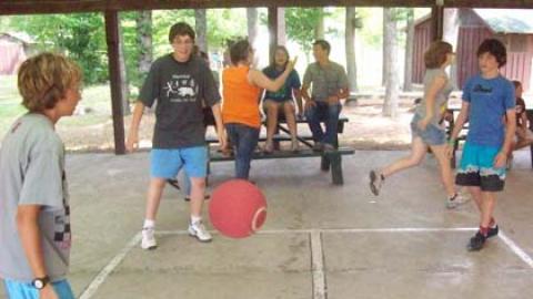 Youth playing 4-square in the rec hall.