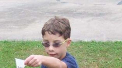 Youth prepares to hit a birdie. 