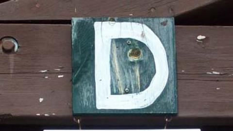 Platoon D name board reading "Little Deuce Coupe"