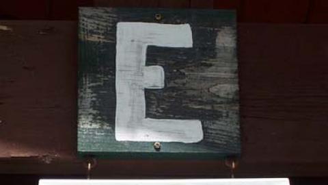 Platoon E name board reading "Wouldn't it be nice"