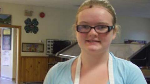 youth displays a culinary creation.