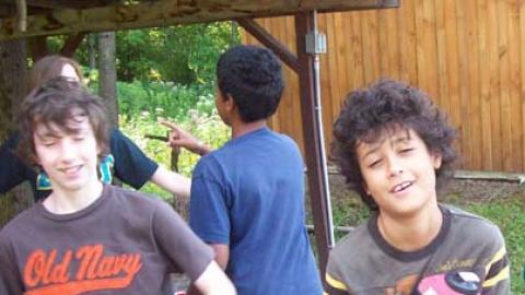 campers holding water bottles during a hiking class. 