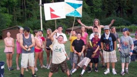 Platoon group cheering with large paper signs.