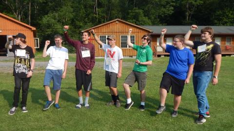 Youth throwing their fists in the air. 