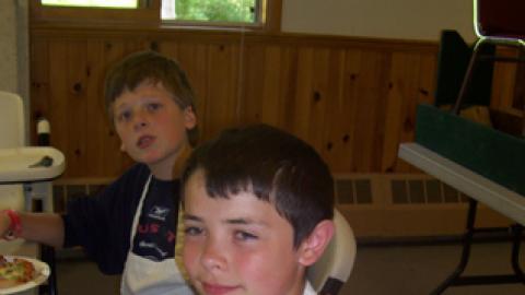 Youth displaying a culinary creation.