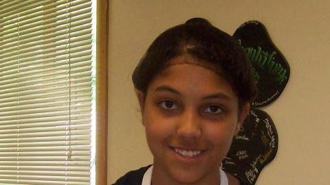 Youth who is participating in the cooking class. 