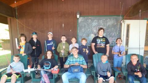 Youth holding their fishing poles. 