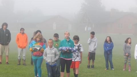 Youth bringing the flag to the pole for the ceremony. 