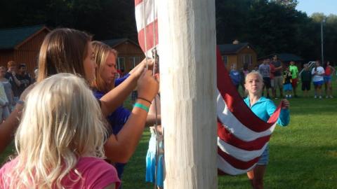 Youth raising the flag. 