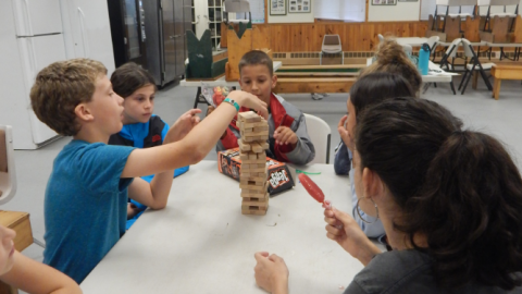 small group playing Jenga.