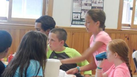 Youth eating a meal in the dining hall. 