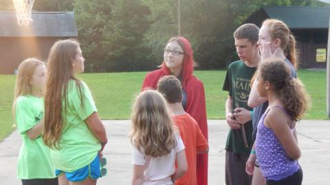 campers standing on the basketball court under the net