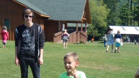Camper running during a relay race. 