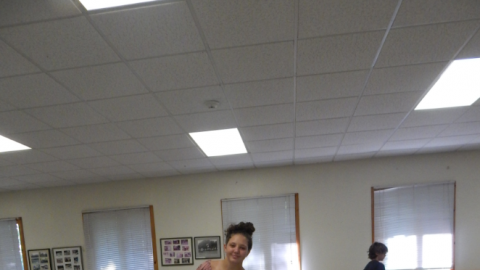 Camper setting a table before a meal.