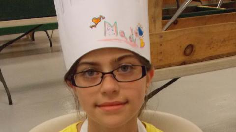 camper holding culinary creation 