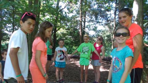campers standing on bridge 