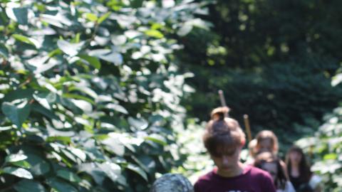 campers walking on trail 