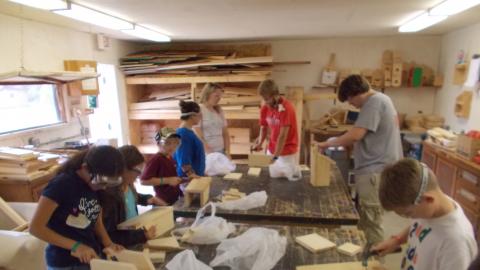 campers completing birdhouses made in the camp wood shop 