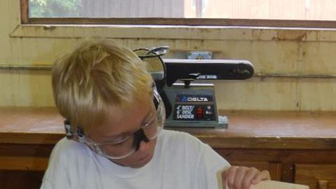 Youth working on a wood project. 