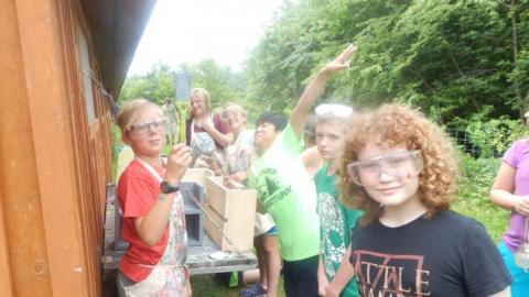 Youth doing a wood working project. 